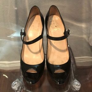 Used authentic Christian Louboutin peep toe pumps